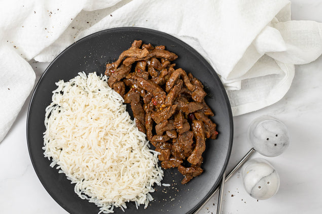 Teriyaki beef strips and fluffy long grain white rice
